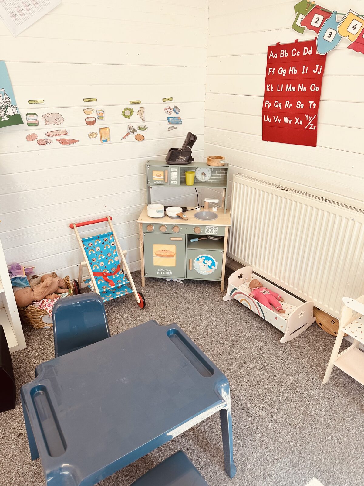 Role play kitchen and home corner in the cabin at Stewart Street nursery, Crewe