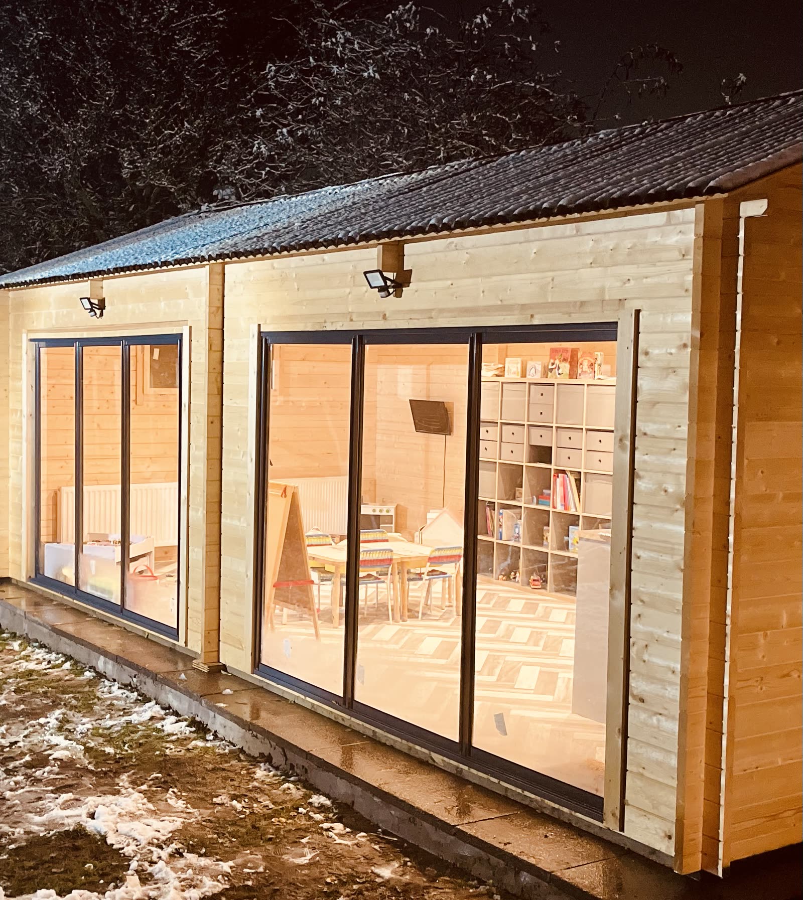 Purpose-built cabin exterior and outdoor play area at Stewart Street nursery, Crewe